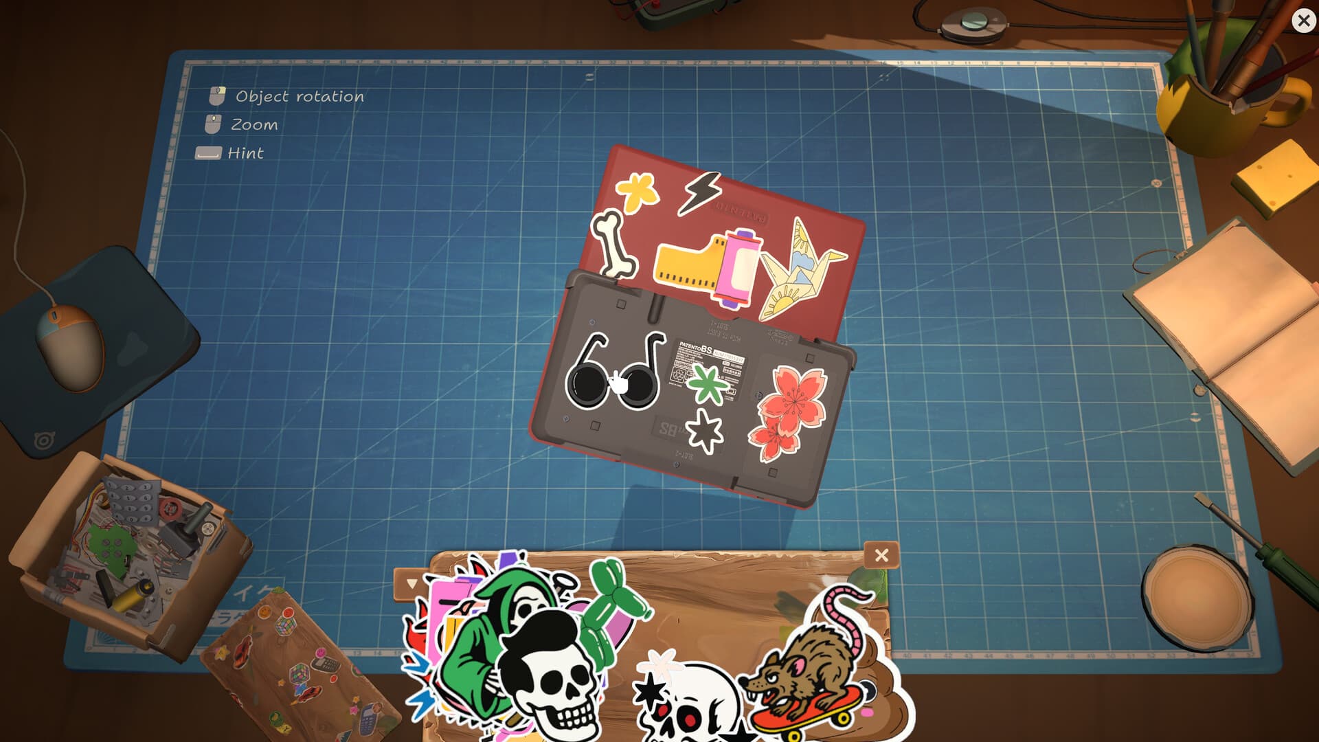 ReStory handheld device decorated with colorful stickers on the repair bench